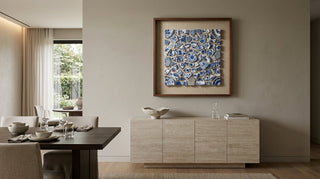 Abstract blue and white porcelain mosaic shadow box wall art displayed in a modern luxury dining room